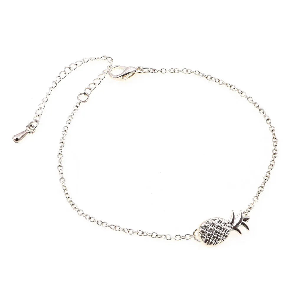 Gold tone and silver tone alloy pineapple bracelets for women on a white background.