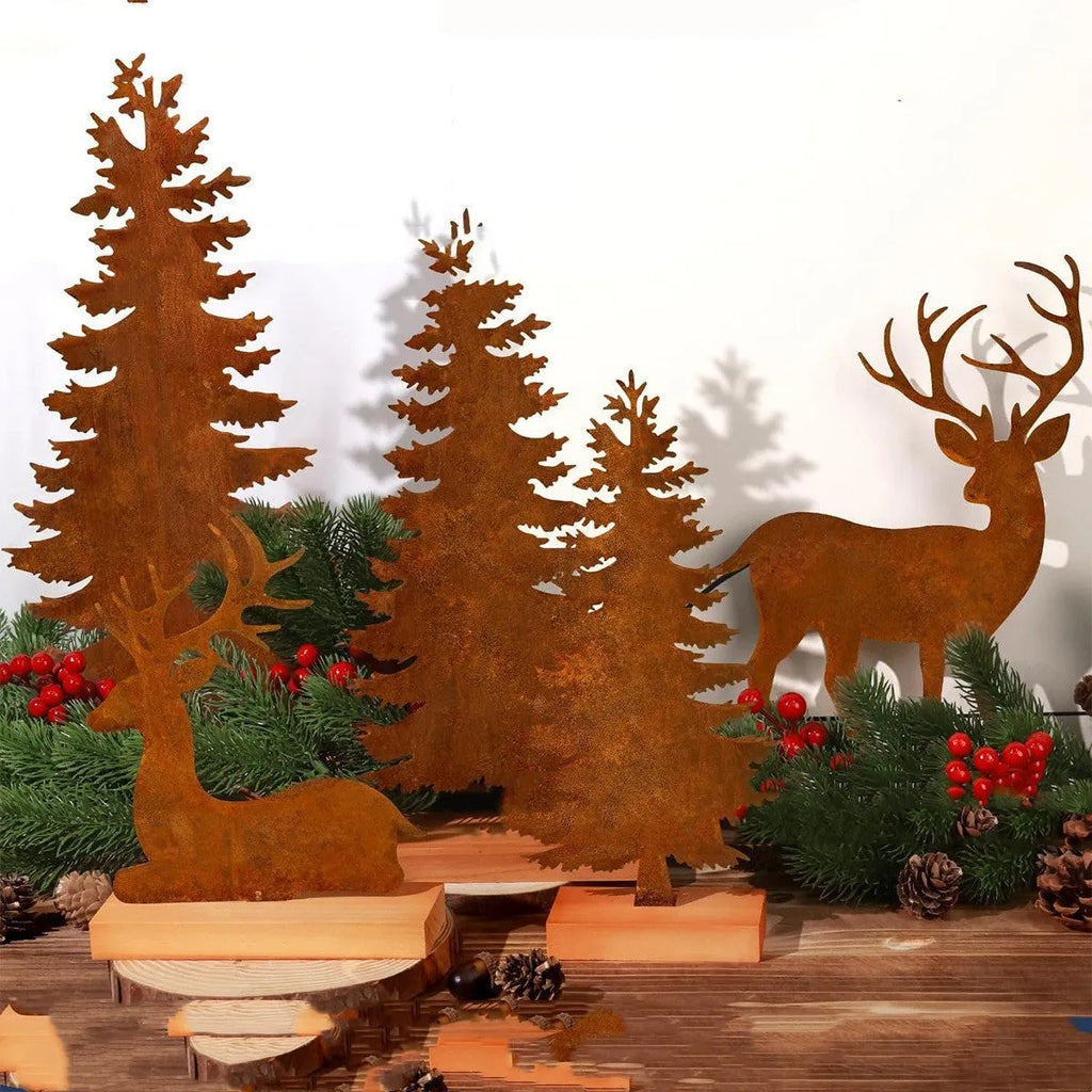 Set of three rusty metal Christmas ornaments featuring elk with antlers and trees, on a white background