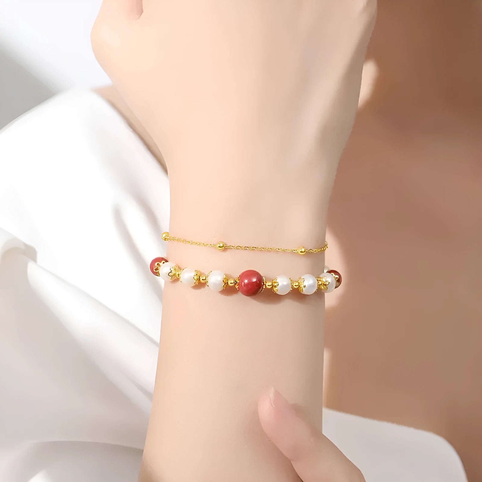 Sterling silver double-layer bracelet with white freshwater pearls and cinnabar red beans