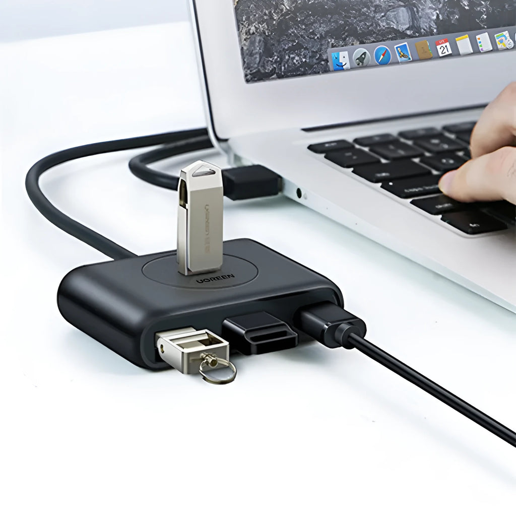 Deep black USB splitter hub with four ports, ABS plastic shell, and indicator light on desk