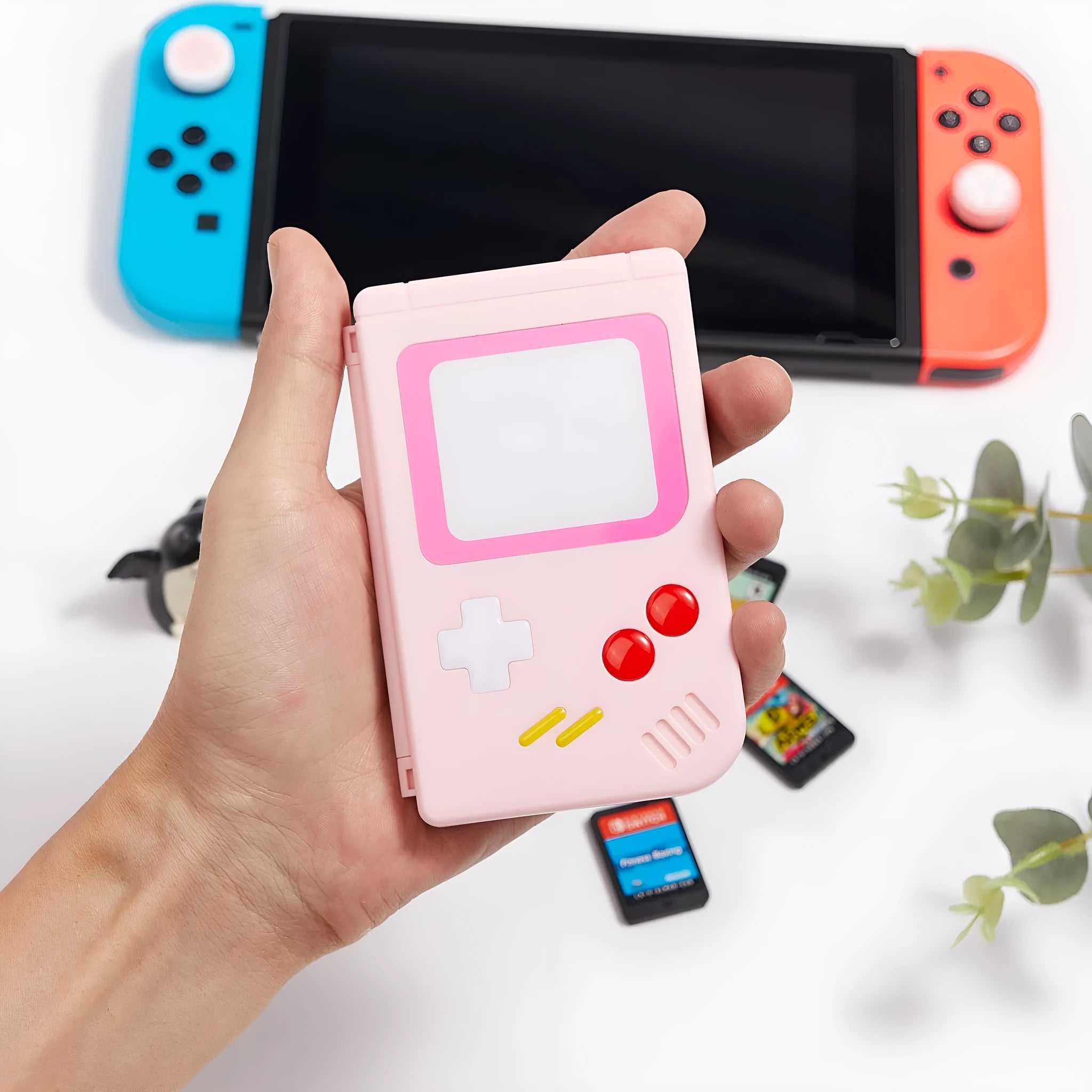 Compact blue Nintendo SWITCH game card storage box, shown next to game cards.