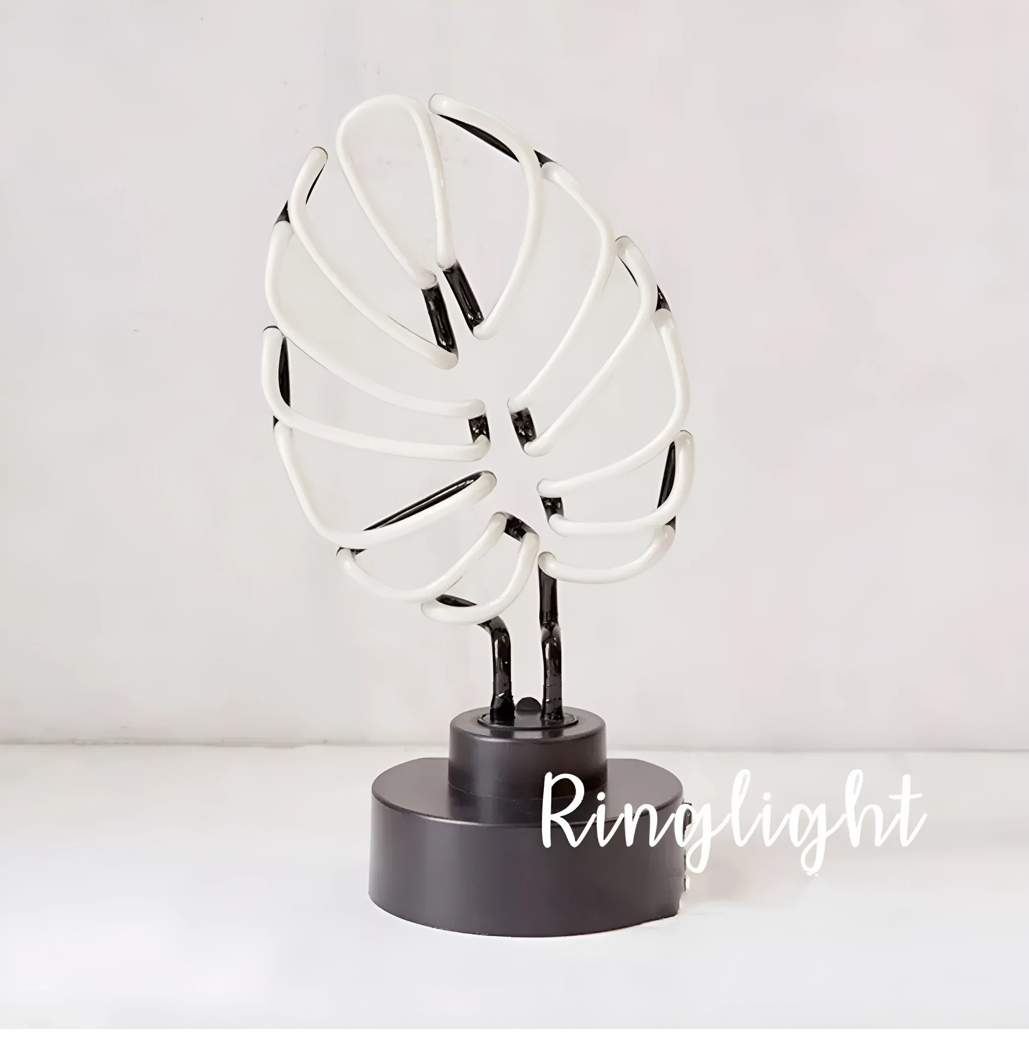 Minimalist bamboo-shaped desktop lamp with USB cable and green illumination