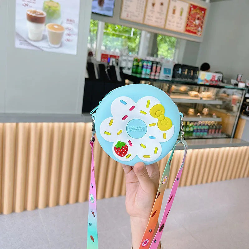 Silicone children's coin purse in round yellow with cartoon donut pattern and crossbody strap