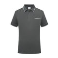 Man wearing a light apricot lapel polo shirt with short sleeves and a chest pocket.