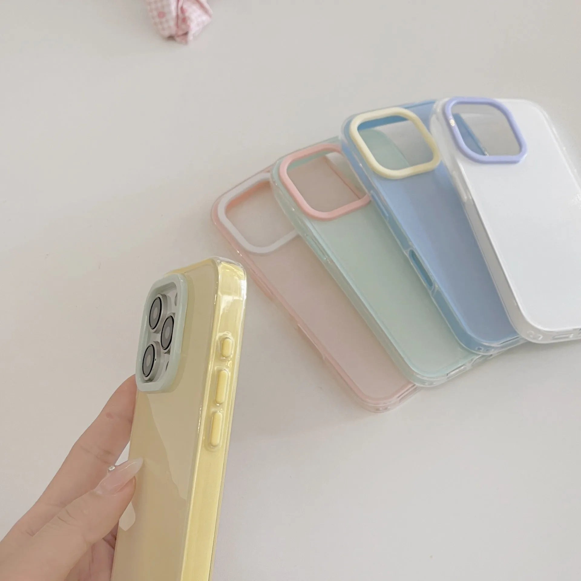 Translucent solid colour TPU jelly phone case for iPhone on a white background.