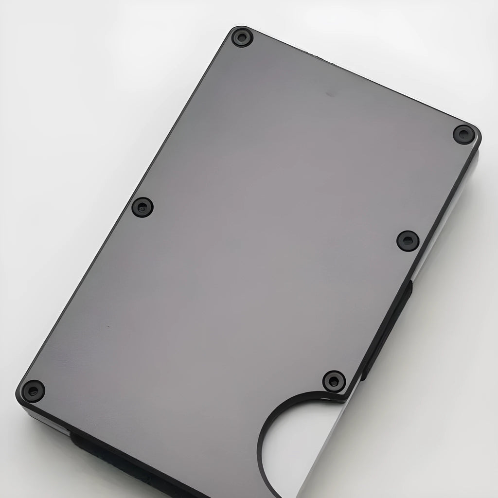 Slim aluminium alloy grey carbon fibre wallet with RFID blocking for cards.