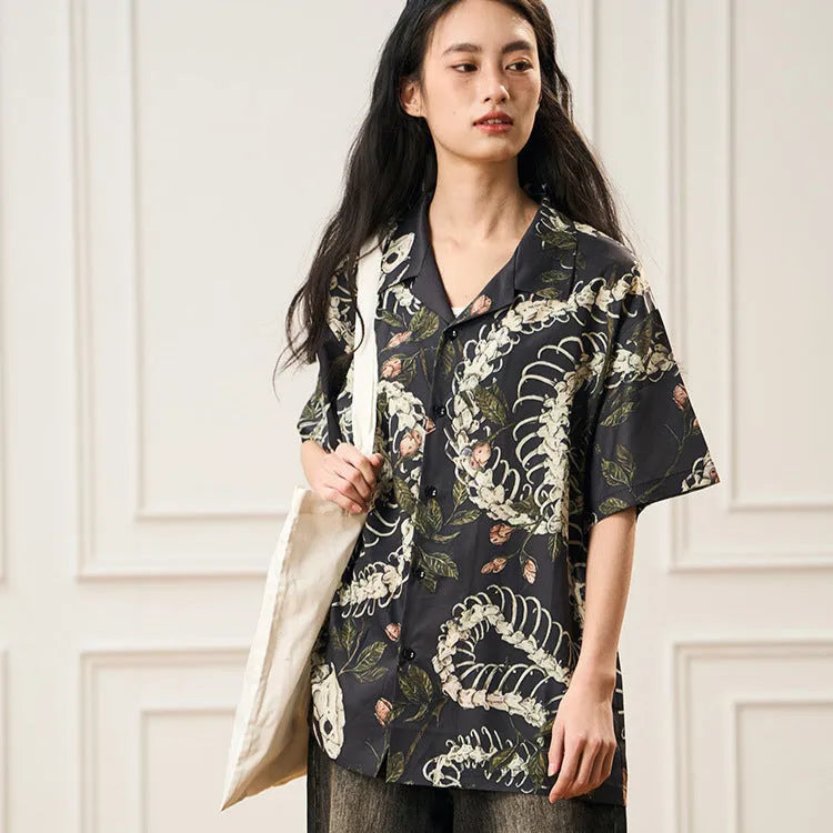 Short sleeve loose fit Cuban collar shirt with a printed snake bone pattern design in a colour option.
