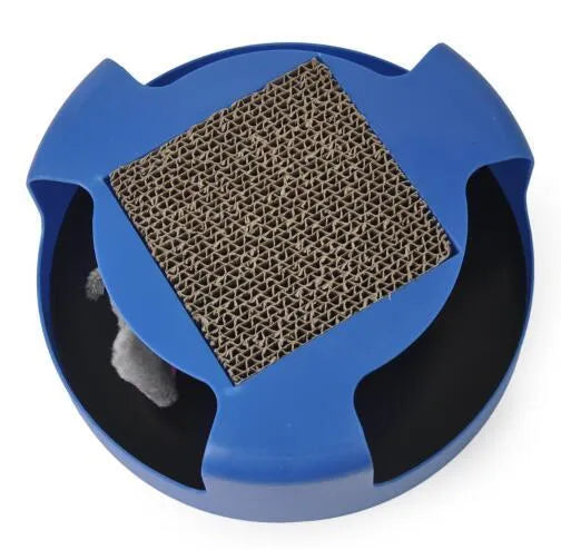 Blue rotating plastic cat toy with felt scratchpad on top standing on a floor