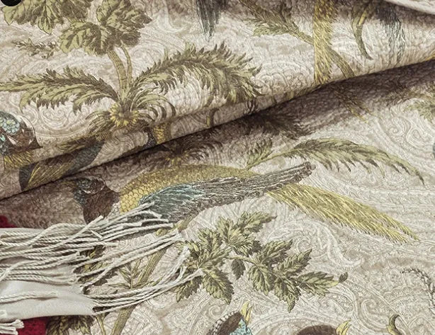 Blue American floral pattern cotton quilted bedspread set of three pieces laid on a bed.