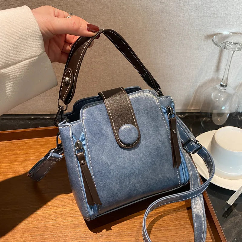PU shoulder crossbody bag in white, blue or black with adjustable strap and retro street style