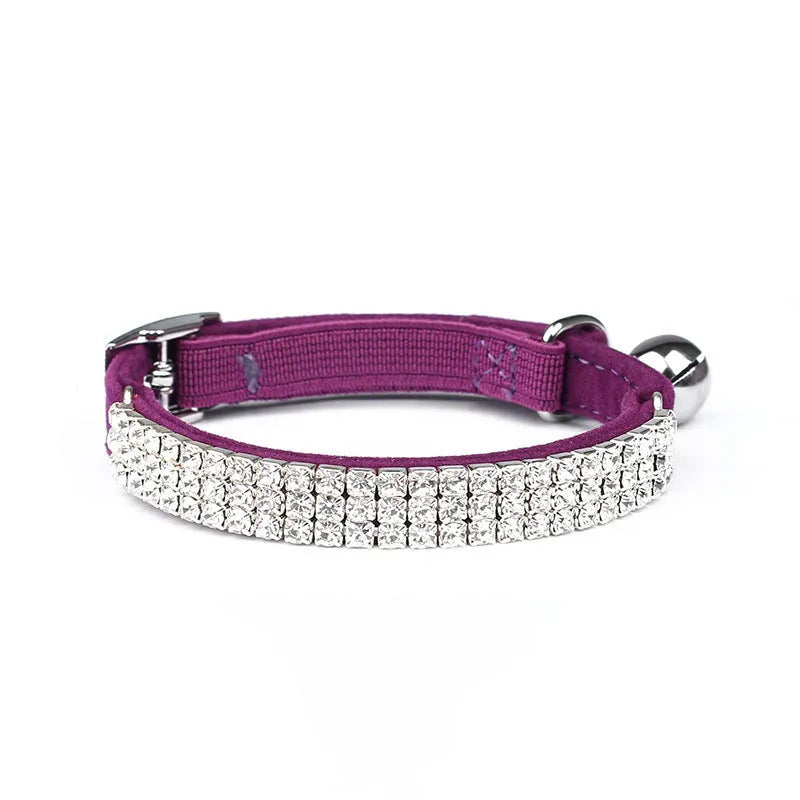 Adjustable velvet cat collar with a rhinestone in red, blue, purple, black, or pink.