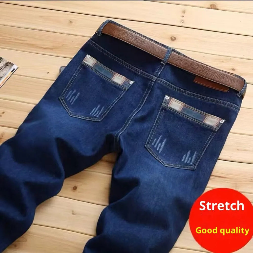 Men's slim-fit skinny jeans in dark blue, mid-rise with zipper fly, sizes 28 to 40