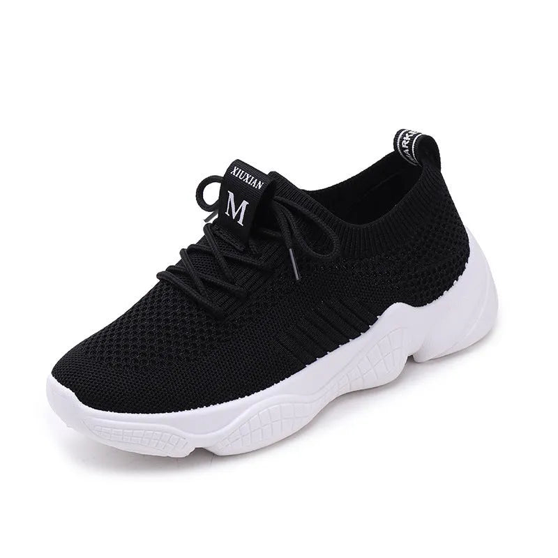 White thick-soled women's flyknit trainers with front strap and rubber sole.