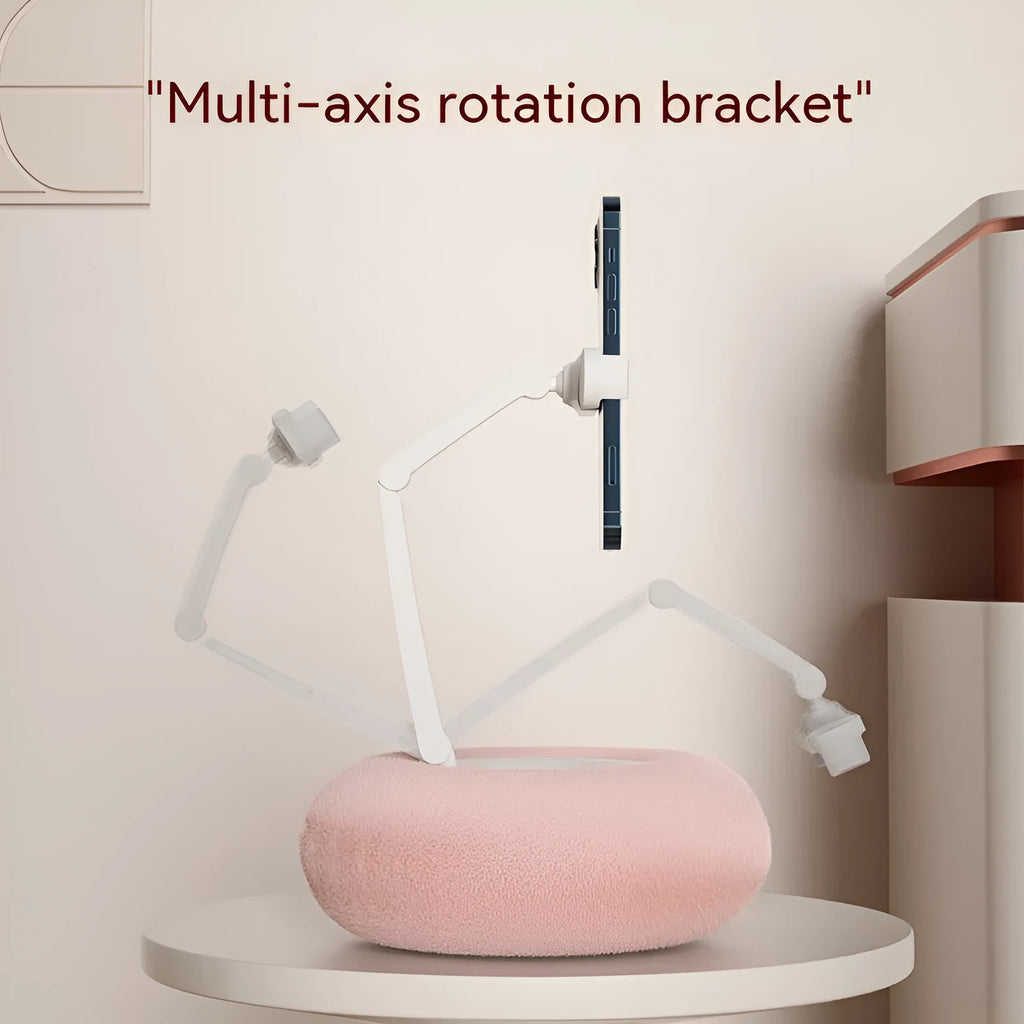 Adjustable rotating phone and tablet bracket on a desk, showing the clamp and fabric base.