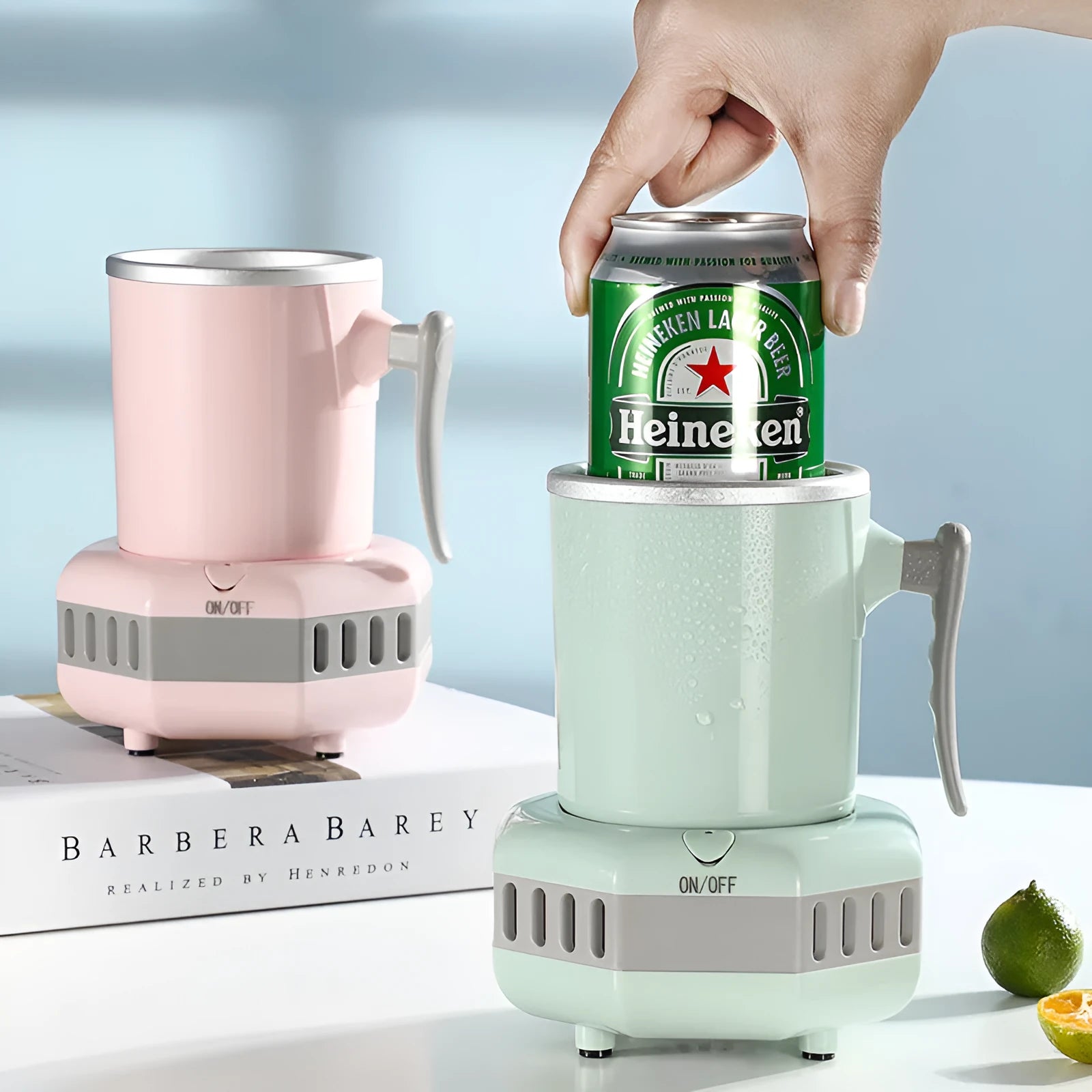White mini quick cooling cup with aluminium drinking vessel and electronic base on a desk.