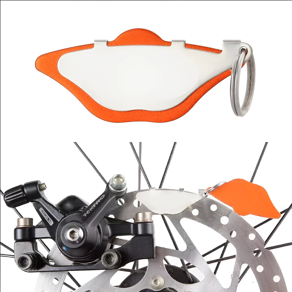 Mountain bike disc brake pads in black and orange metal construction