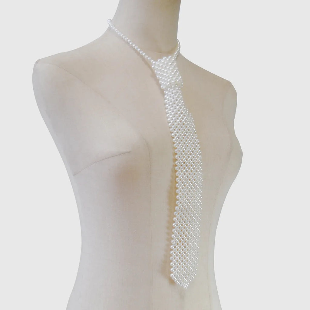 Women's pearl tie body chain with hollow-out design in white or black colour.
