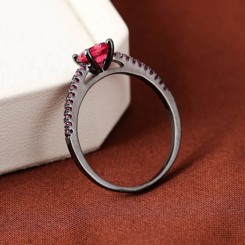 Colourful hexagonal zircon ring in copper with electroplated finish on a size 7 finger.