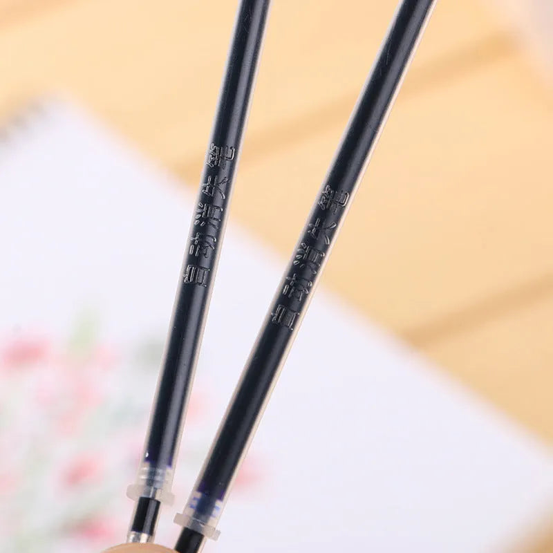 Automatic fade and disappear pen set showing pen holder, case, and eight refill cartridges of vanishing ink