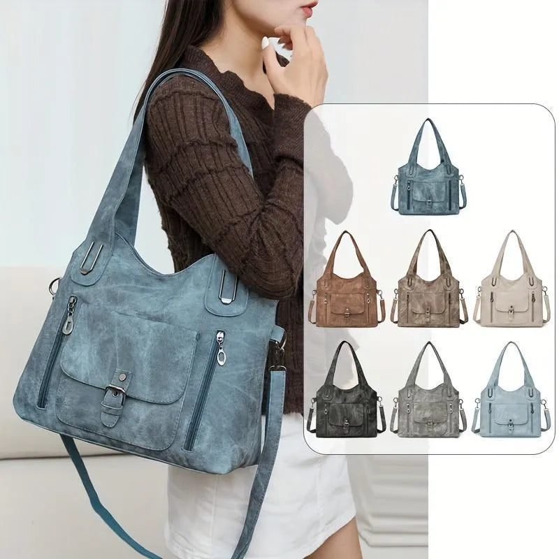 Soft synthetic leather handbag with metal accent in vintage style, colour example shown