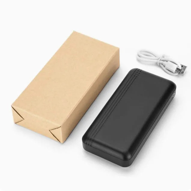 Graphene heating clothing power bank with plastic shell and USB cable on white background
