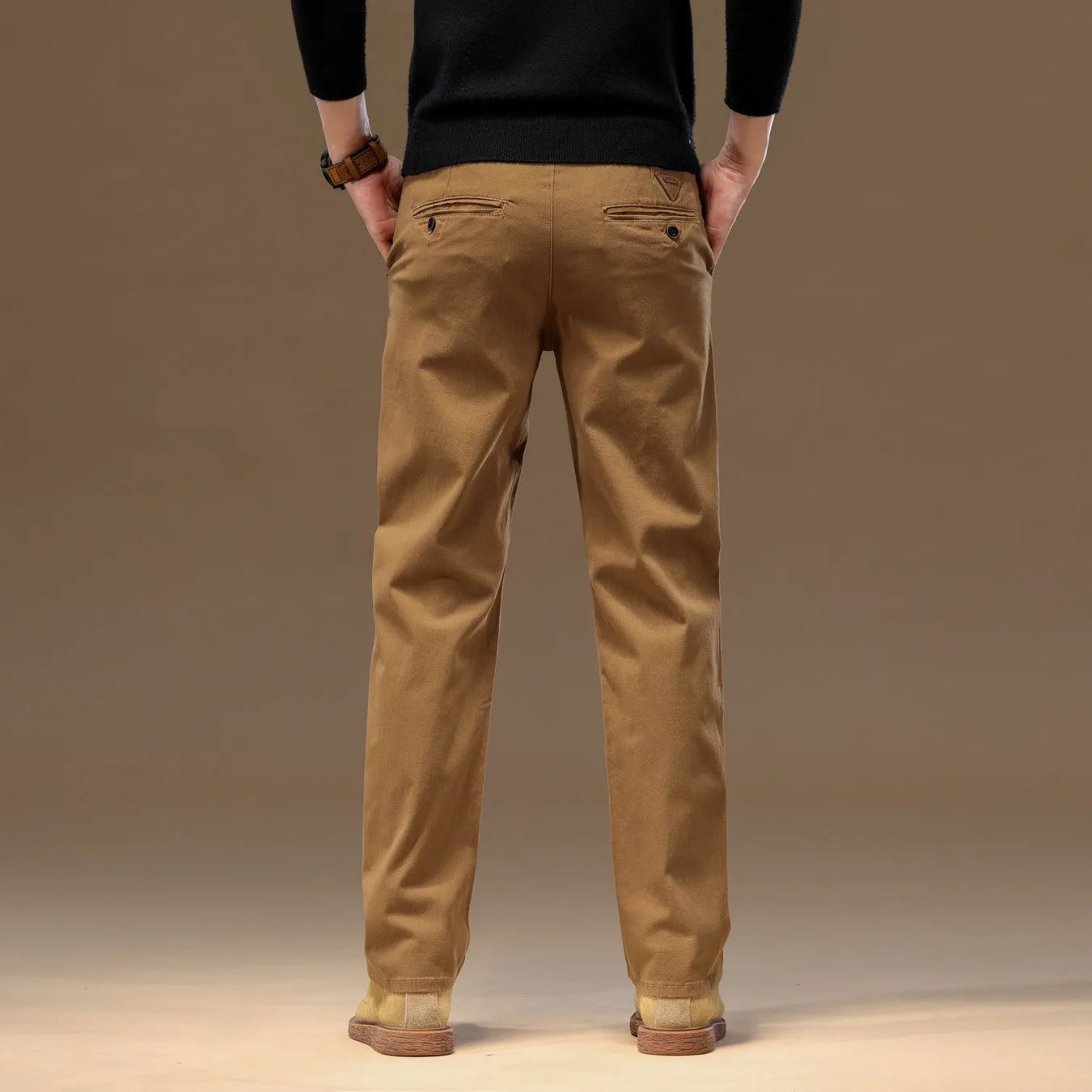 Men's cotton denim loose straight casual trousers in rust red with zip fly and elastic waist, front view
