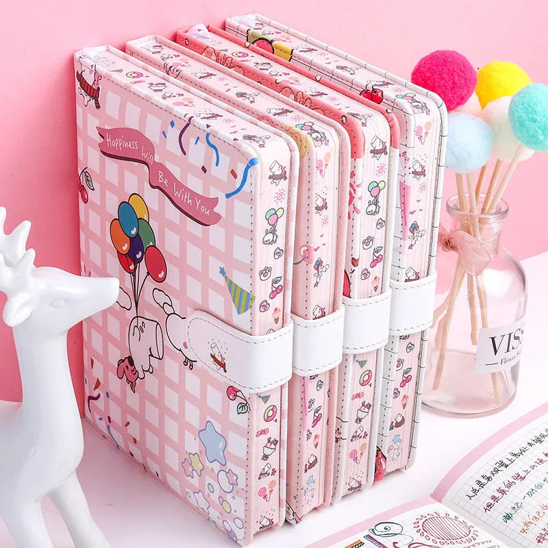 White Kaba Bear Hippo A6 notebook with magnetic buckle and heart design, showing size next to a pen.