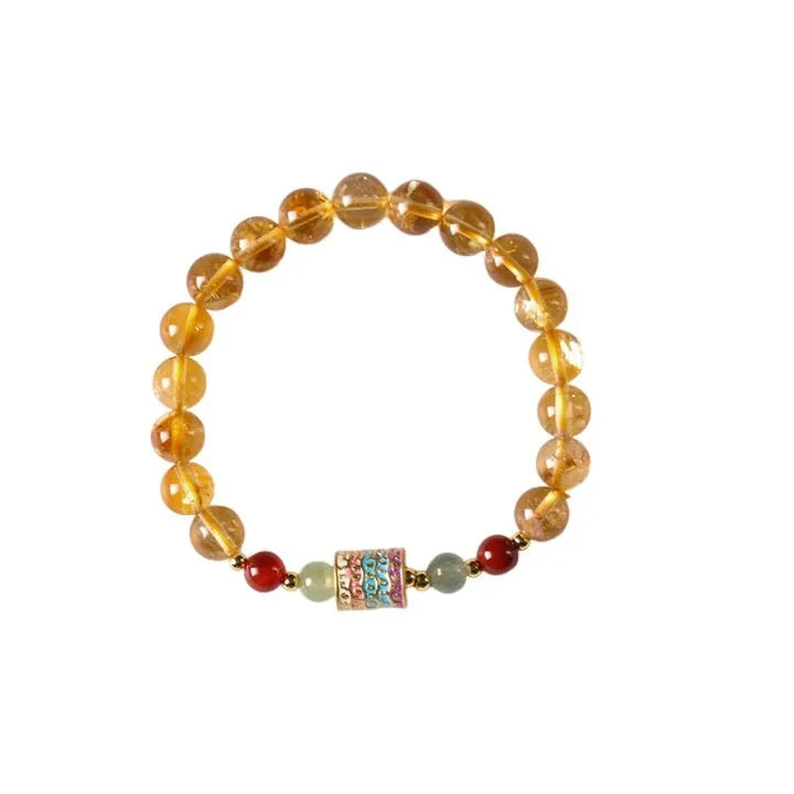 Yellow citrine bracelet with prayer wheel elements on 8mm round beads