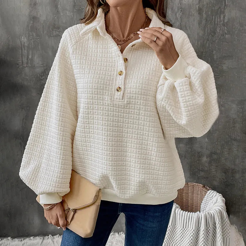 Women's beige thick polo collar long sleeve sweater laid flat.
