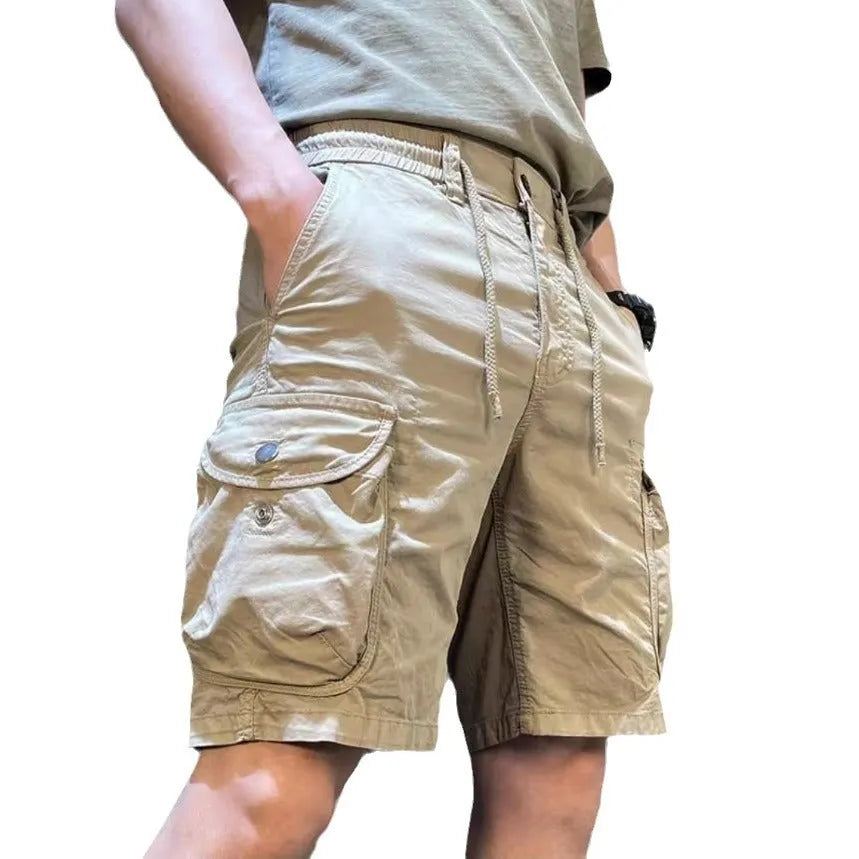 Loose straight cut casual overalls pants with multiple pockets in khaki colour.