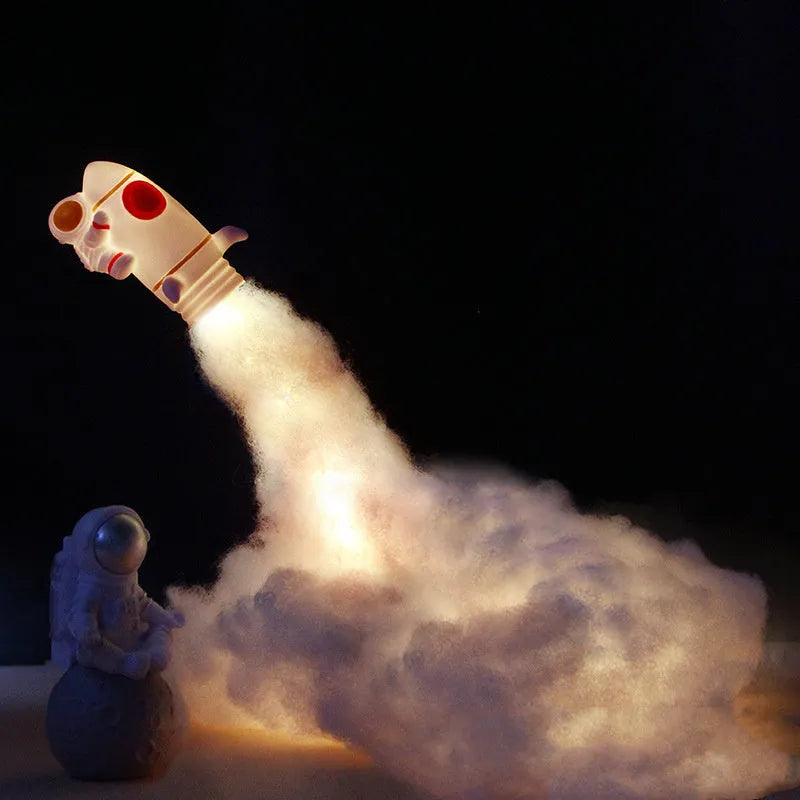 DIY astronaut rocket LED night light kit components including model, straws, chassis, and string lights for assembly