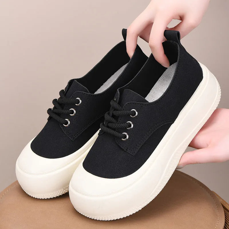 Women's camel suede platform loafers with round toe and front lace-up closure on flat rubber sole