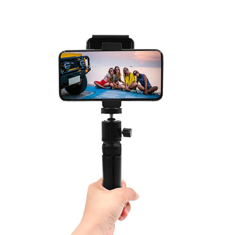 Silver aluminium alloy clip bracket for mounting an Apple iPhone onto a table-top tripod.