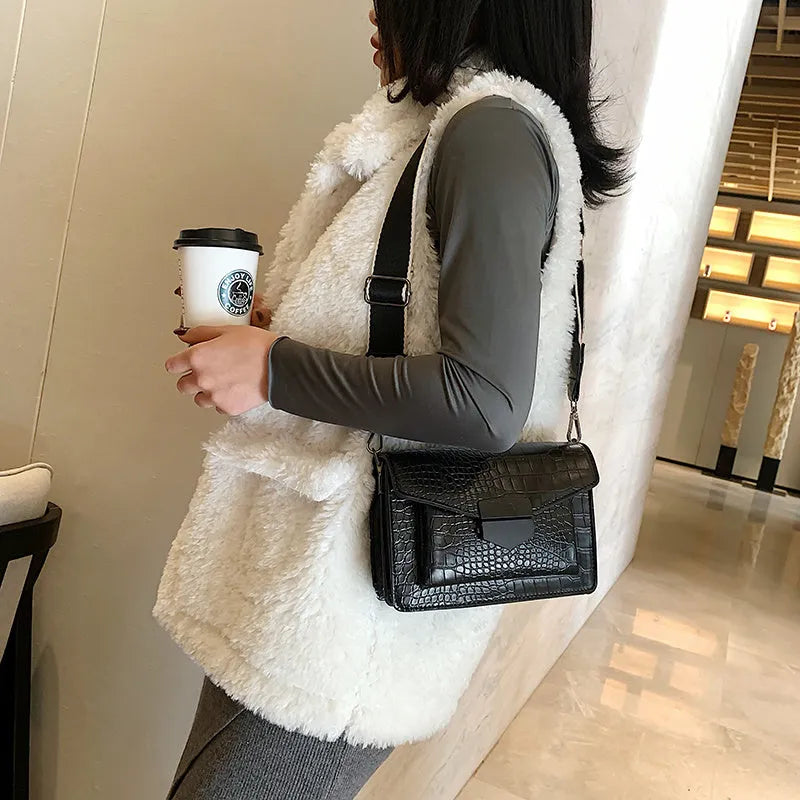 Vintage-style black PU crossbody bag with adjustable strap showing interior