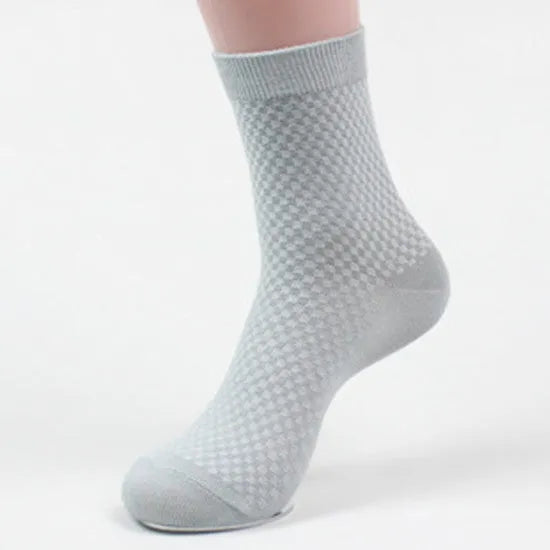 Pair of men's bamboo fibre business socks with small square pattern, shown in navy blue.