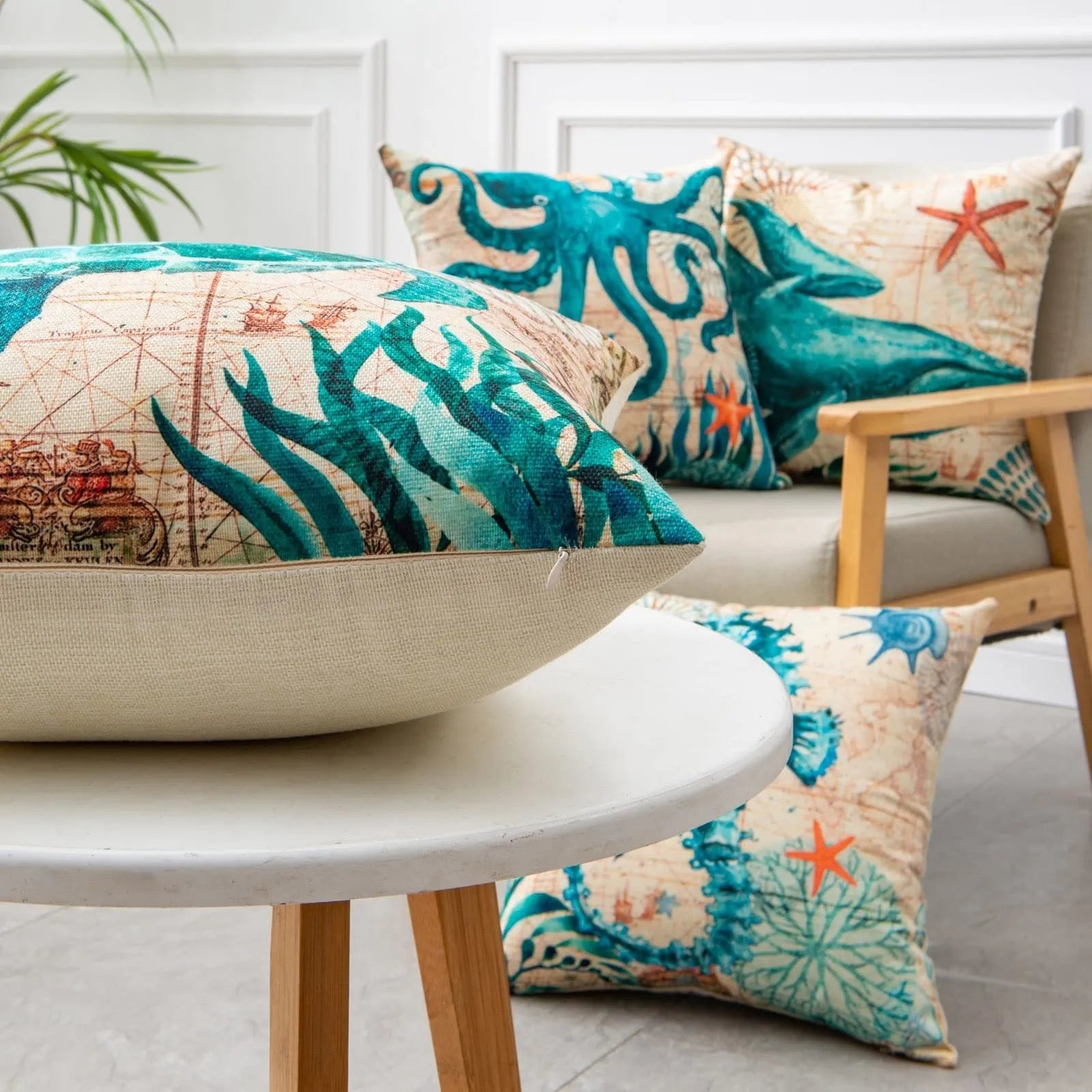 Square linen cushion cover with blue sea turtle print, showing invisible zipper closure.