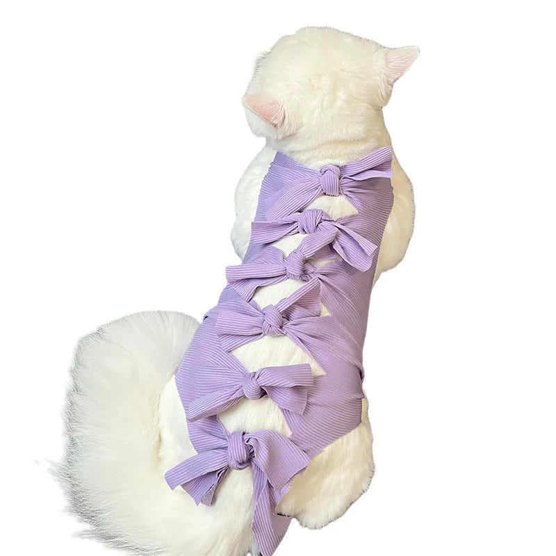 Lace-up polyester cat sterilisation clothing shown in blue on a mannequin, sizes for cats 1.5kg to 9kg.