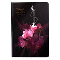 A5 notebook with luminous cover and silver foiling, open to show pages with colour illustrations.