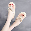 Women's beige high-heeled flip-flop sandals with cotton cloth upper on a light background.