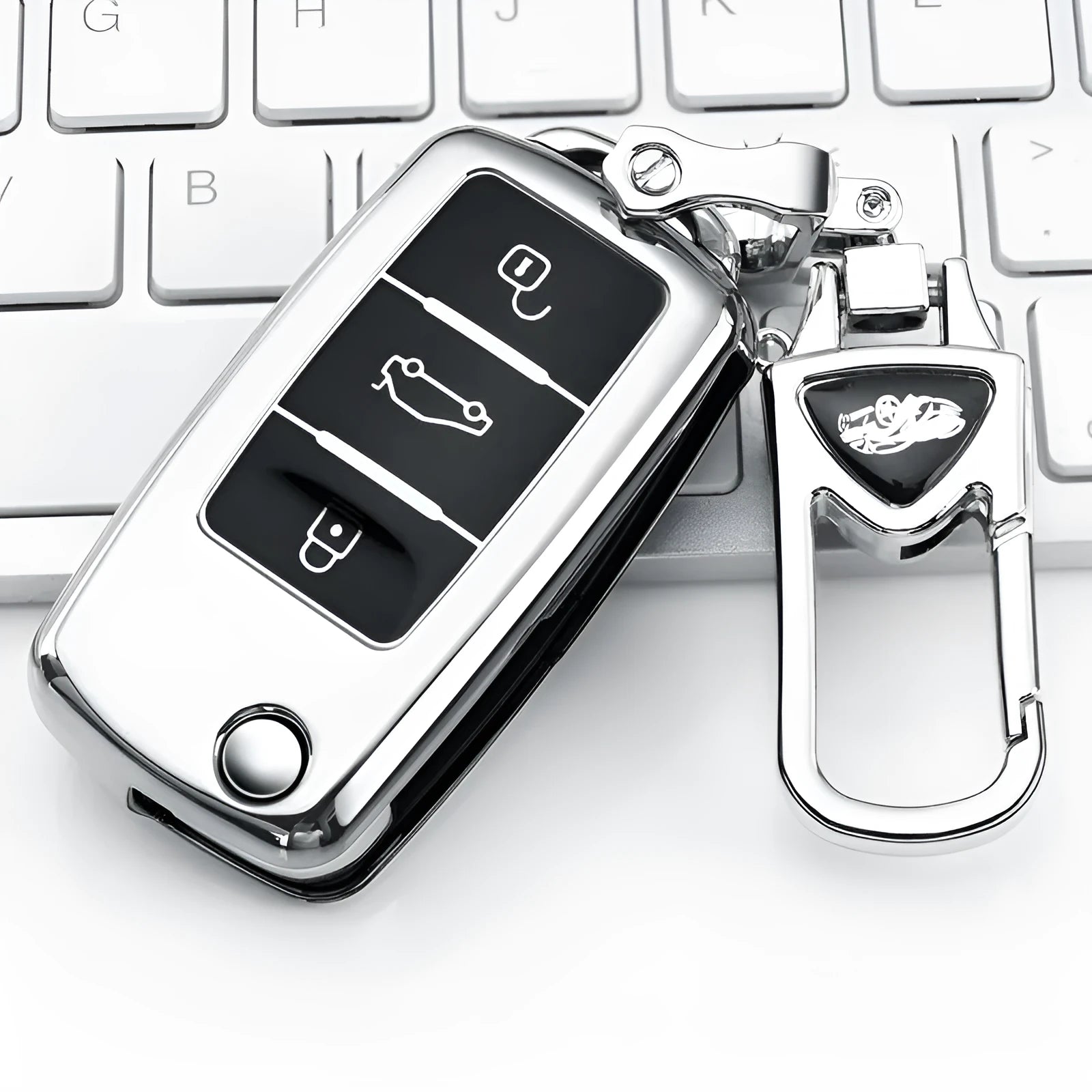 VW Model A folding car key enclosed in a coloured TPU protective case with a metal buckle loop.