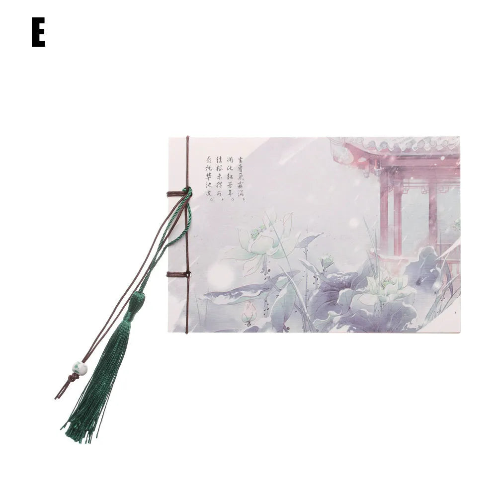 A5 kraft paper notebook with a hand-stitched binding and a hanging tassel bookmark in a natural design.
