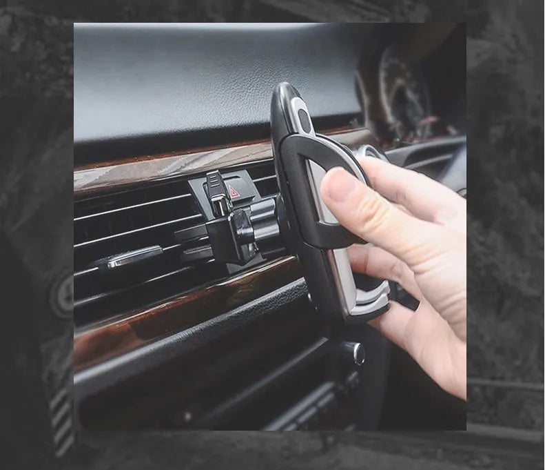 Black plastic car air conditioning outlet mobile phone holder mounted in vehicle vent