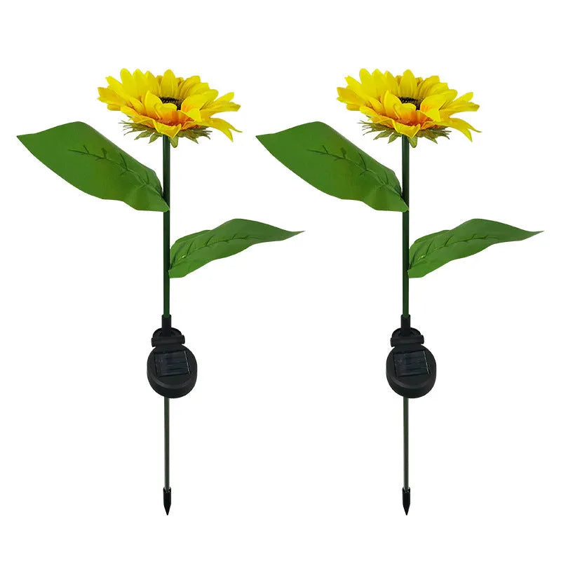 Set of LED solar sunflower garden lights with yellow Bujuan flower heads and stainless steel stems placed along a pathway
