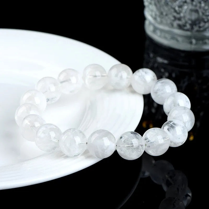 Women's crystal bracelet with natural blizzard snowflake round beads and traditional Chinese decorative elements
