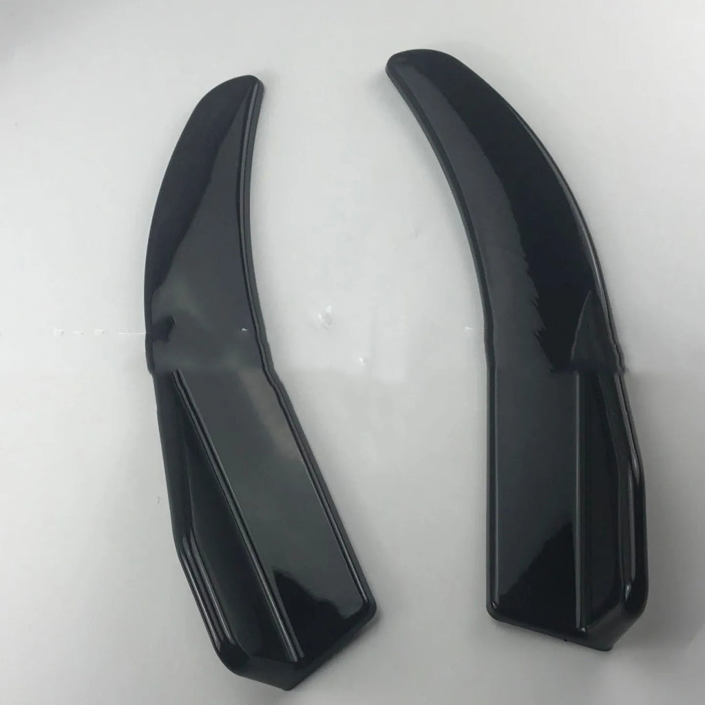 Front and rear car deflector kit for GM vehicles in black and carbon fibre finishes.