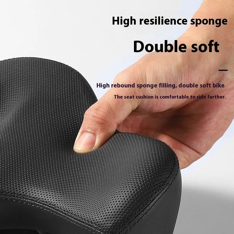 Black leather bicycle seat cushion with thick foam padding on a bike saddle.