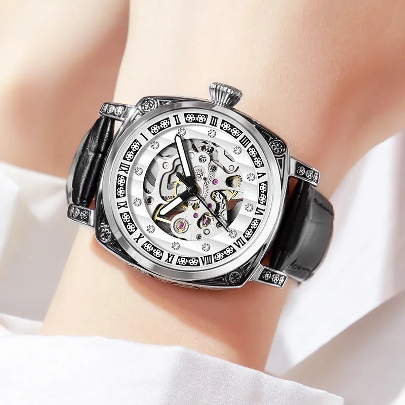 Mechanical watch with leather strap and luminous hands on a dial, shown in multiple colour options.