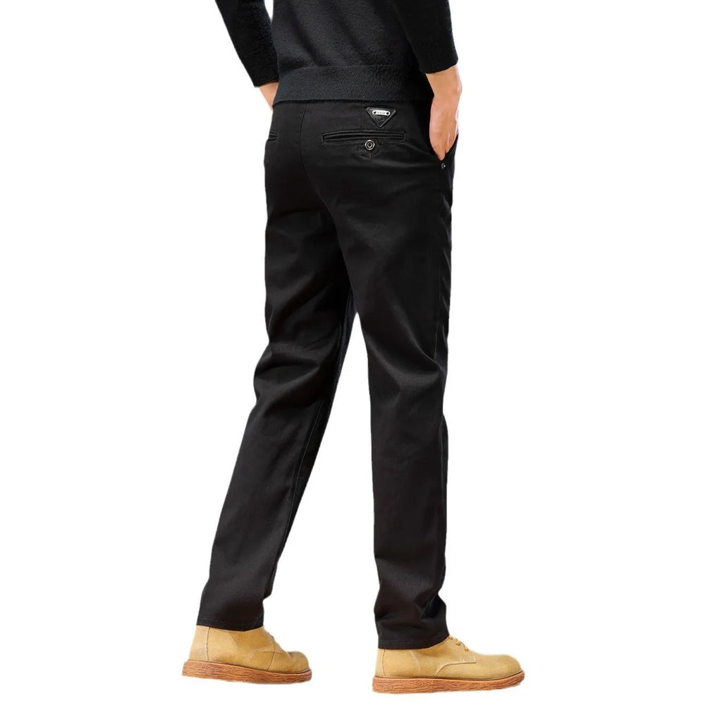 Men's cotton denim loose straight casual trousers in rust red with zip fly and elastic waist, front view