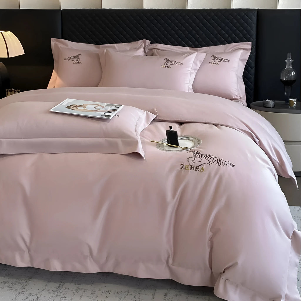 Solid colour pure cotton four-piece bedding set with light brushed finish on a bed in a modern bedroom