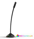 Black wired microphone with adjustable stand and foam windscreen on a desk.